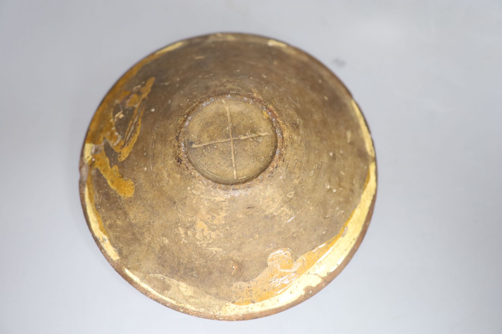 An early 19th century slipware basket, Donyatt Somerset and a similar slipware dish, diameter 18cm